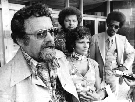 Pody Poe at a 1975 press conference outside the federal courthouse, with "Barbara No. 2" and a groovy assortment of characters at his side.