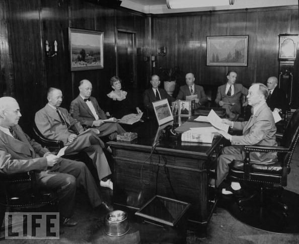 Oklahoman publisher E.K. Gaylord meets with his editorial staff, circa 1940s.
